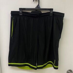 Reebok Men's Black Shorts with Green Accents